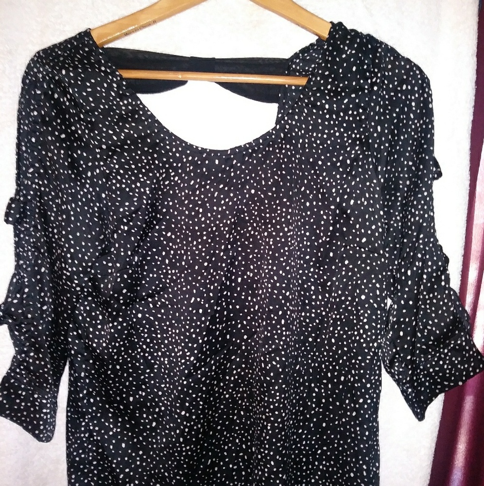 Polka dot shirt.